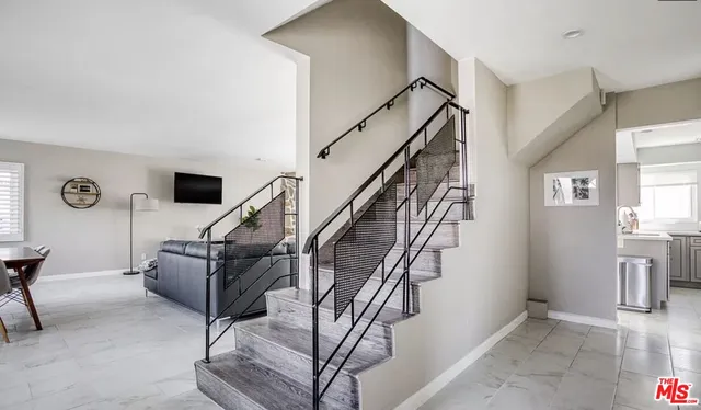 a livingroom with furniture staircase and a living room