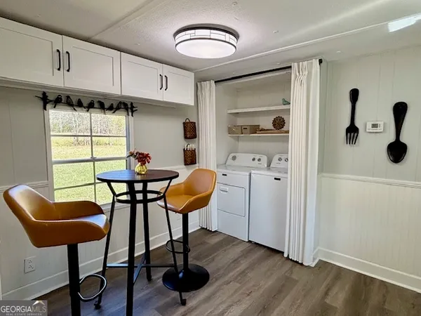 a dining room with furniture and window