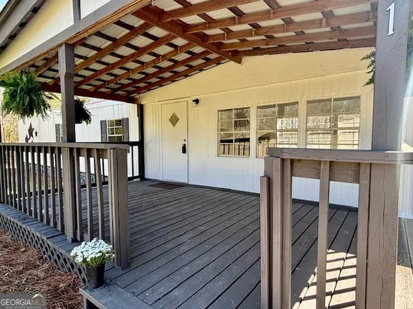 a view of entryway with wooden floor
