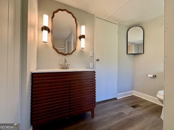 a bathroom with a sink and a mirror