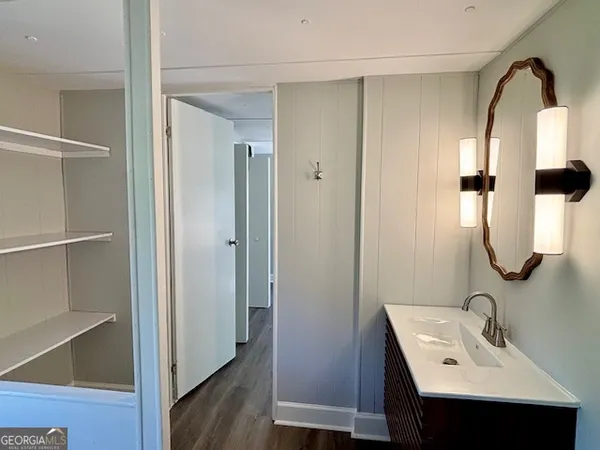 a bathroom with a sink and mirror