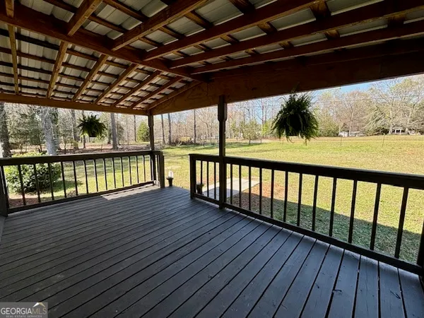 a view of a balcony with wooden floor