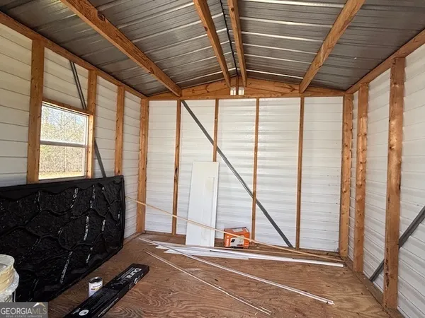 a view of an empty room with windows