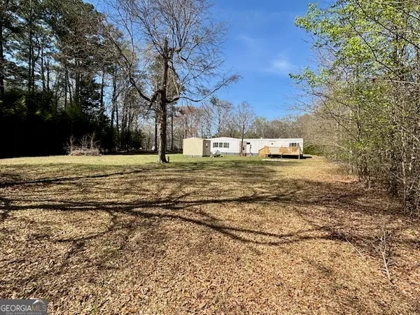 a fire hydrant in the middle of a yard