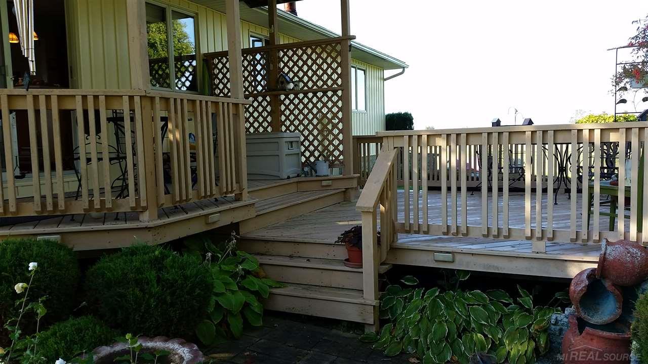 6071 Brady Road Palms, MI 48465 - Photo 3 of 10 2-tier deck off from the Dining room makes a great outdoor living space