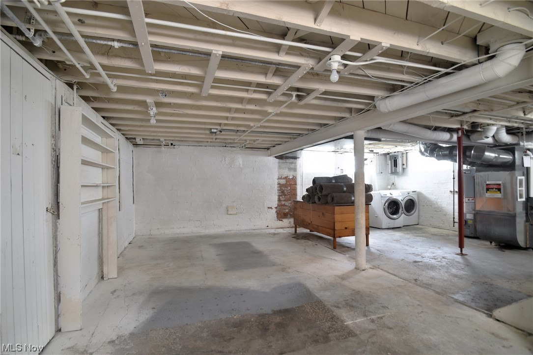 1135 Plainfield Road Cleveland, OH 44121 - Photo 28 of 32 Basement featuring heating utilities, gas water heater, and independent washer and dryer