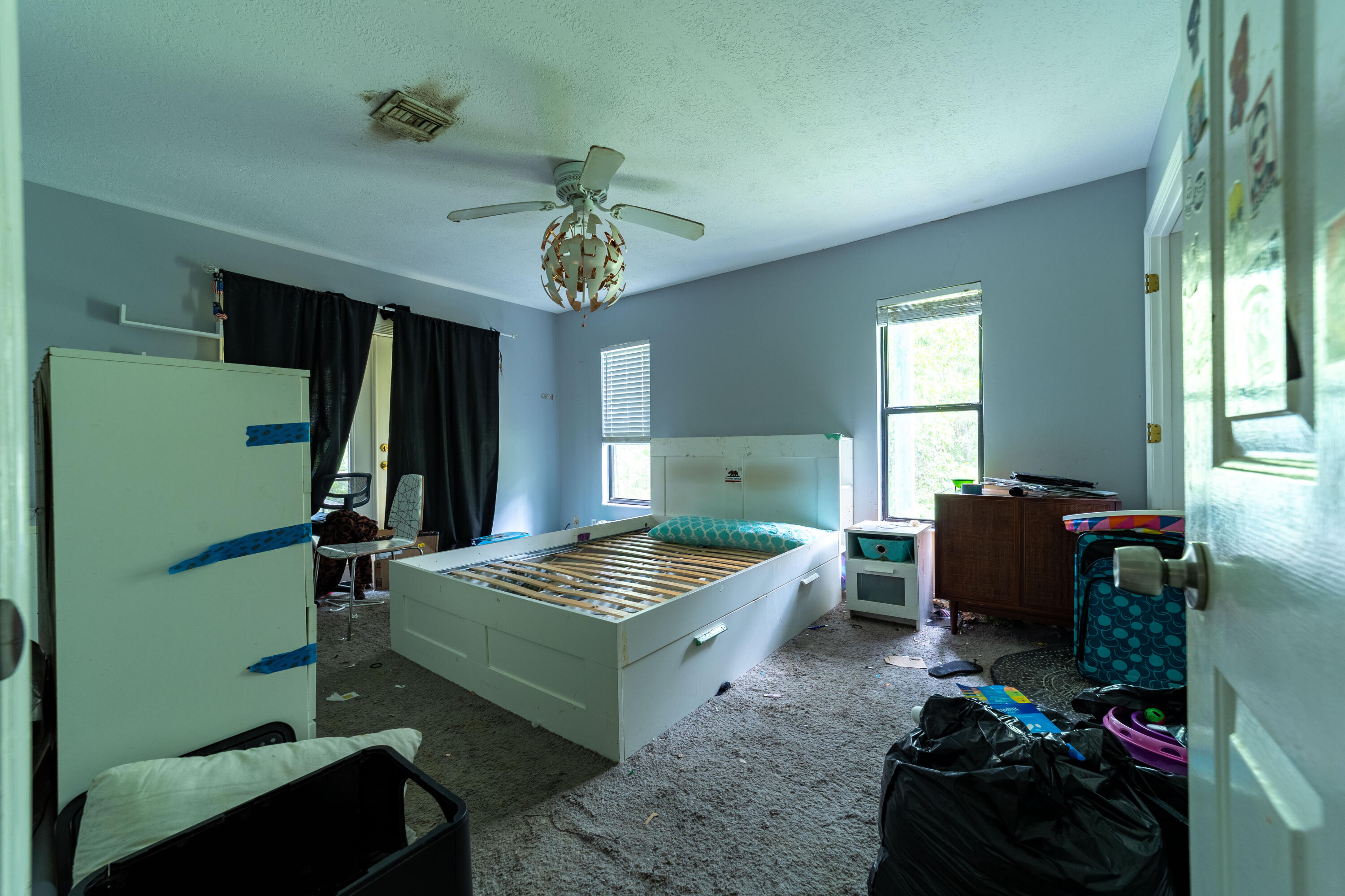 15184 Alexander Run Jupiter, FL 33478 - Photo 11 of 35 a room with furniture and a window