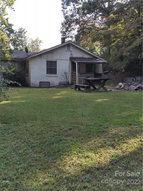 3600 Lake Adger Road Mill Spring, NC 28756 - Photo 2 of 9 a view of a house with backyard and garden