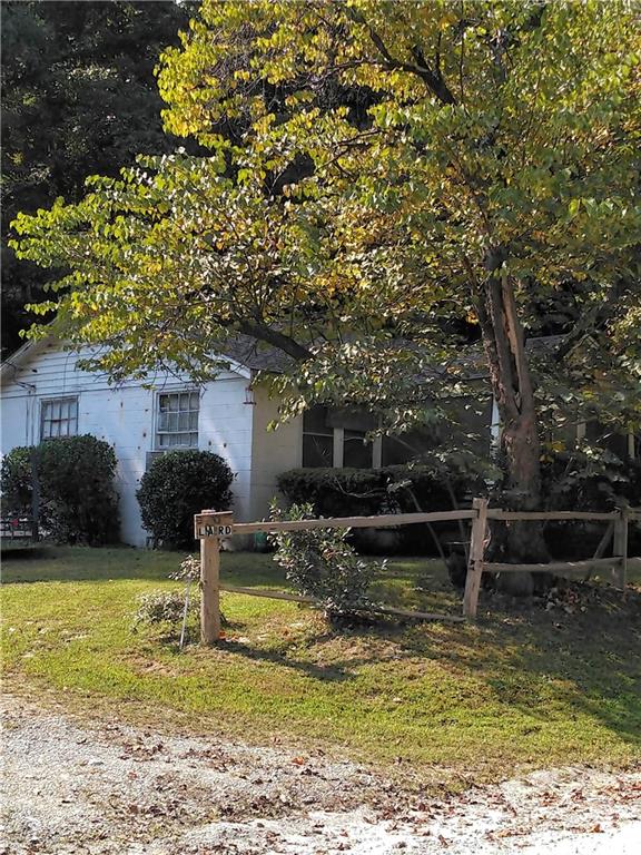 3600 Lake Adger Road Mill Spring, NC 28756 - Photo 4 of 9 a view of a house with swimming pool and a yard