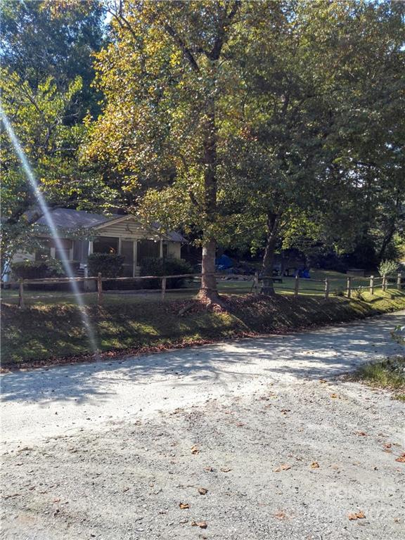 3600 Lake Adger Road Mill Spring, NC 28756 - Photo 5 of 9 a view of a yard with large tree