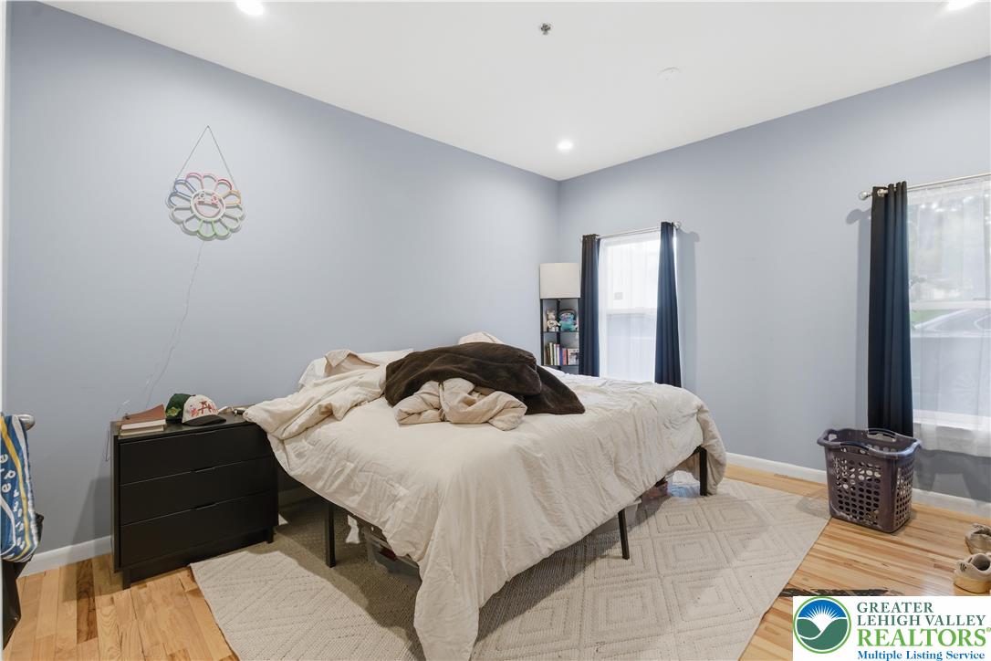 623 Walnut Street, Unit A2 Easton, PA 18042 - Photo 15 of 21 a bedroom with a bed and a flat screen tv