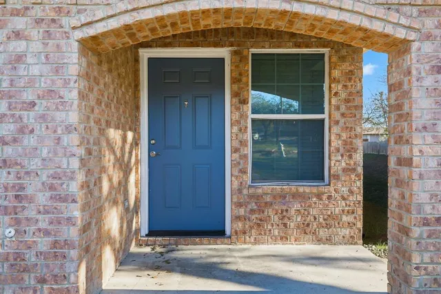 front view of a brick house with a door