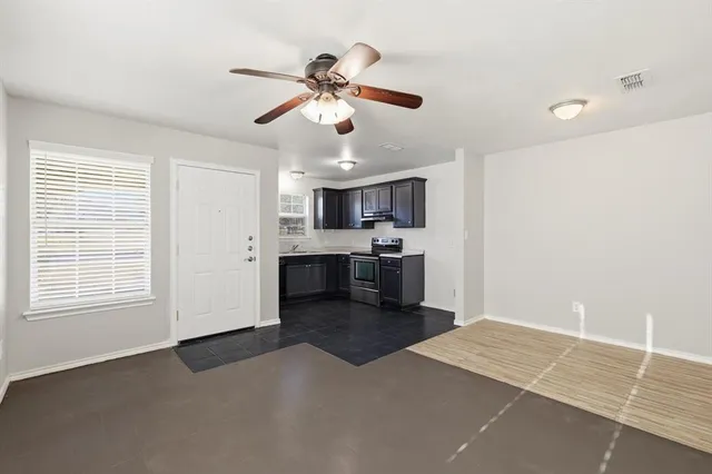 a view of kitchen with sink and cabinets