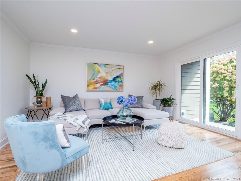 2 Quincy Close, Unit 2 Ridgefield, CT 06877 - Photo 1 of 1 a living room with furniture and a large window