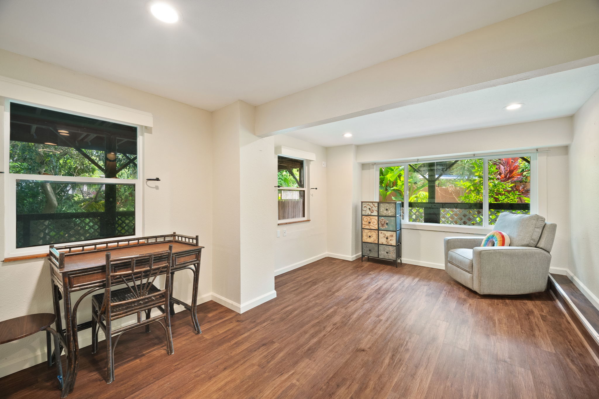 3590 Moloaa Road Kilauea, HI 96754 - Photo 18 of 29 a living room with furniture and a wooden floor