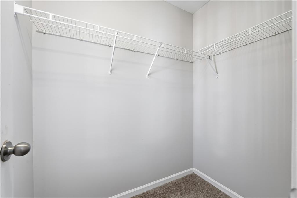 3294 Mill Springs Circle Northeast Buford, GA 30519 - Photo 14 of 22 a view of a room with racks on the wall