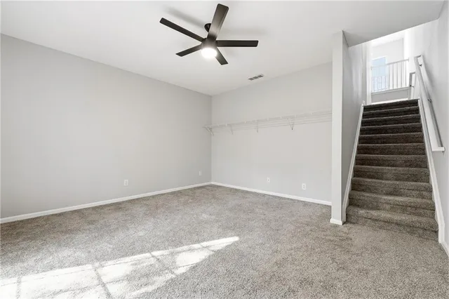 a view of an empty room with stairs