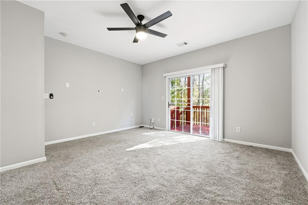 3294 Mill Springs Circle Northeast Buford, GA 30519 - Photo 17 of 22 a view of an empty room with a window
