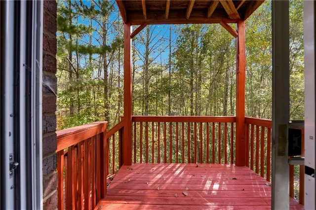 a view of a balcony with wooden floor