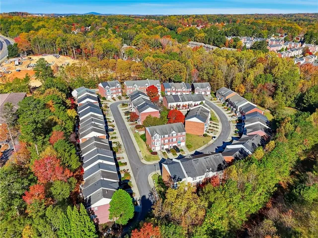 an aerial view of residential house with outdoor space and swimming pool
