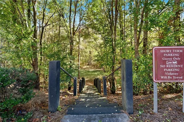 a sign board with a tree