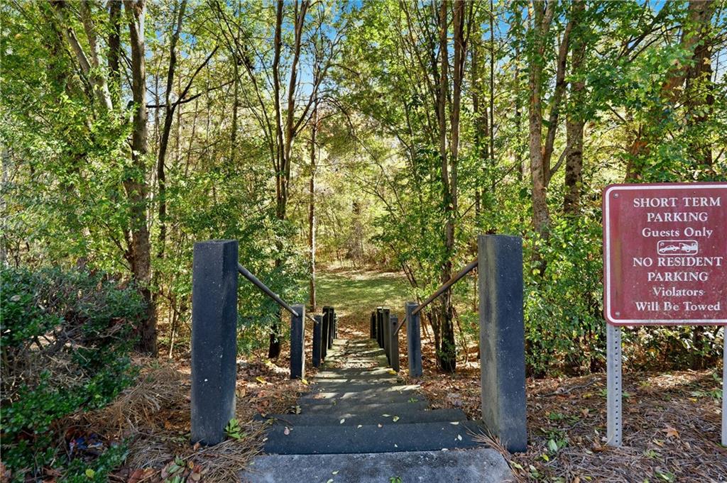 3294 Mill Springs Circle Northeast Buford, GA 30519 - Photo 21 of 22 a sign board with a tree