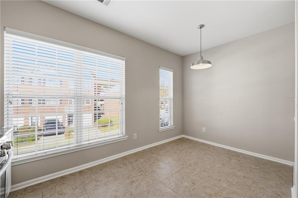 3294 Mill Springs Circle Northeast Buford, GA 30519 - Photo 4 of 22 a view of an empty room with a window