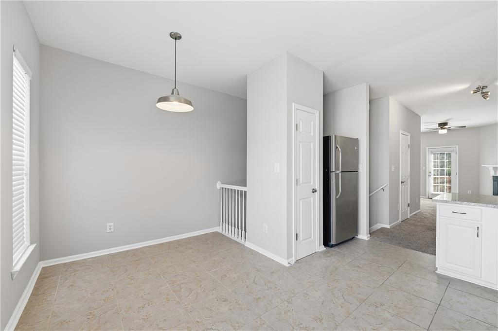 3294 Mill Springs Circle Northeast Buford, GA 30519 - Photo 5 of 22 a view of a kitchen with a refrigerator and a sink