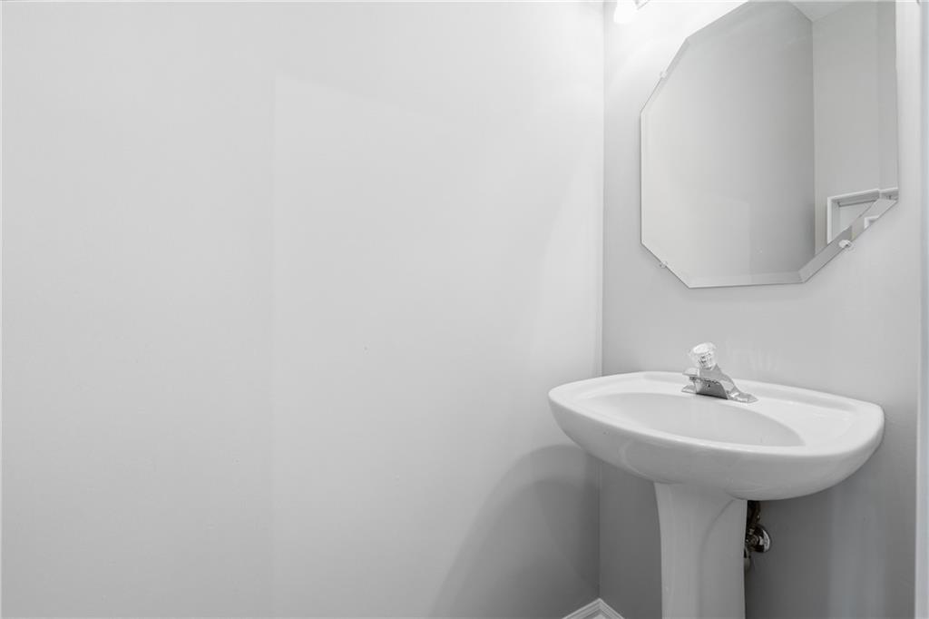 3294 Mill Springs Circle Northeast Buford, GA 30519 - Photo 6 of 22 a bathroom with a sink and a mirror