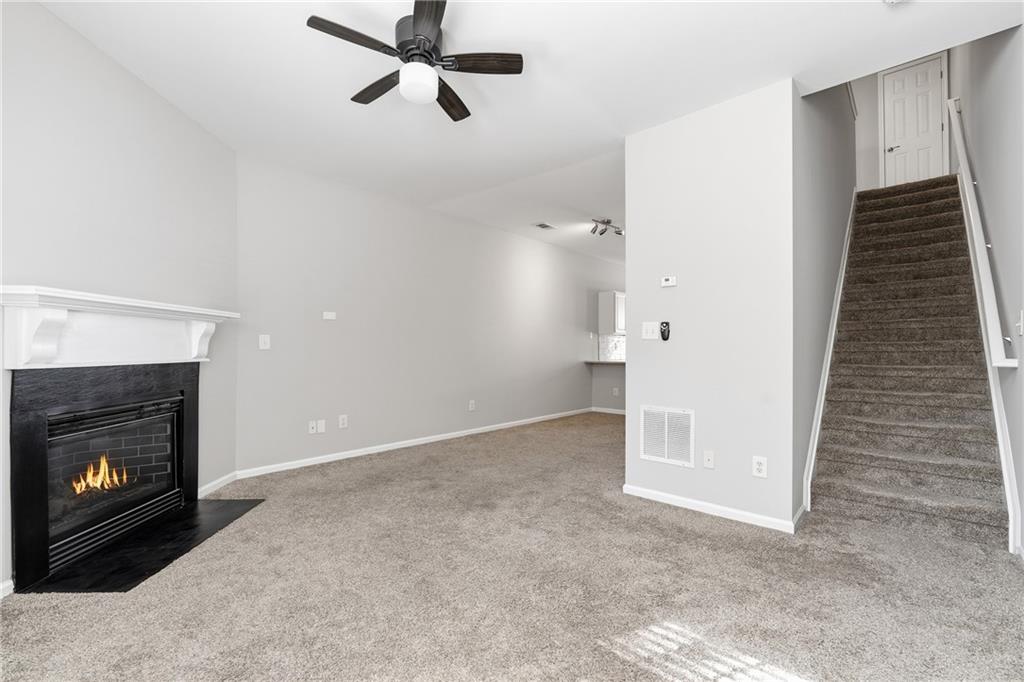 3294 Mill Springs Circle Northeast Buford, GA 30519 - Photo 7 of 22 a view of a livingroom with a fireplace and window