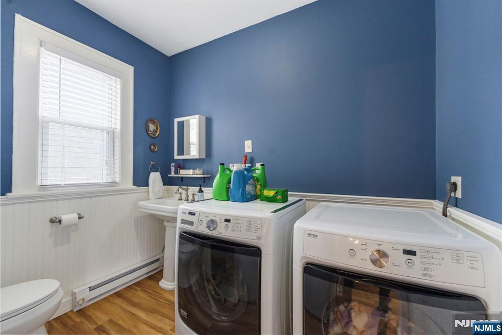 48 Rochelle Avenue Rochelle Park, NJ 07662 - Photo 13 of 30 a utility room with a window dryer and washer