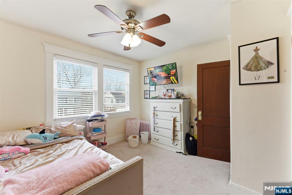 48 Rochelle Avenue Rochelle Park, NJ 07662 - Photo 16 of 30 a bedroom with a bed and furniture