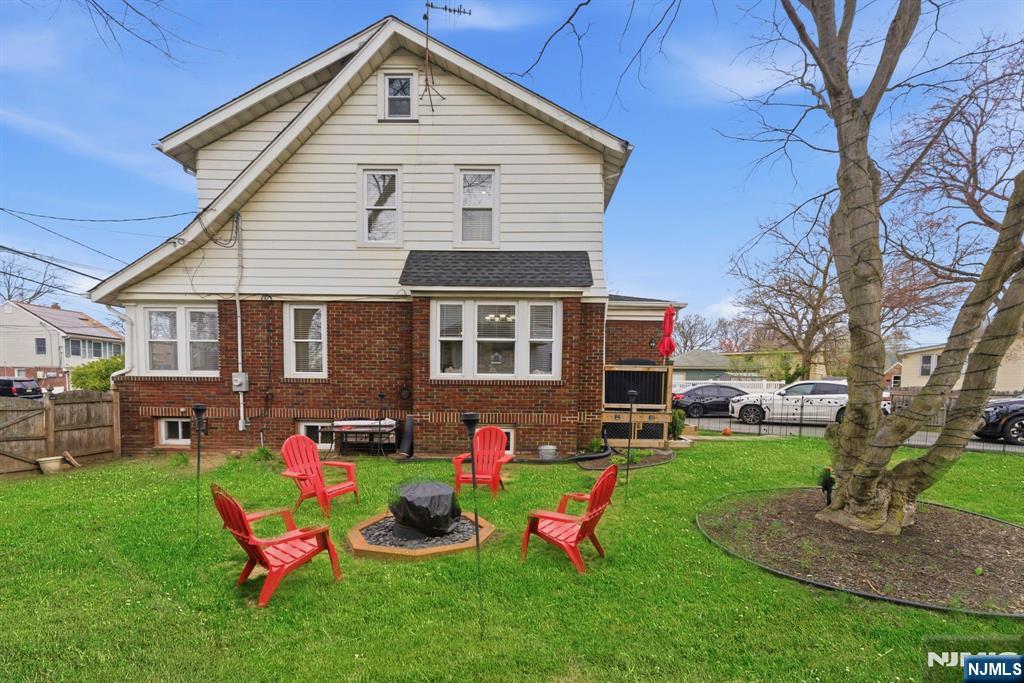 48 Rochelle Avenue Rochelle Park, NJ 07662 - Photo 21 of 30 a front view of house with yard and outdoor seating