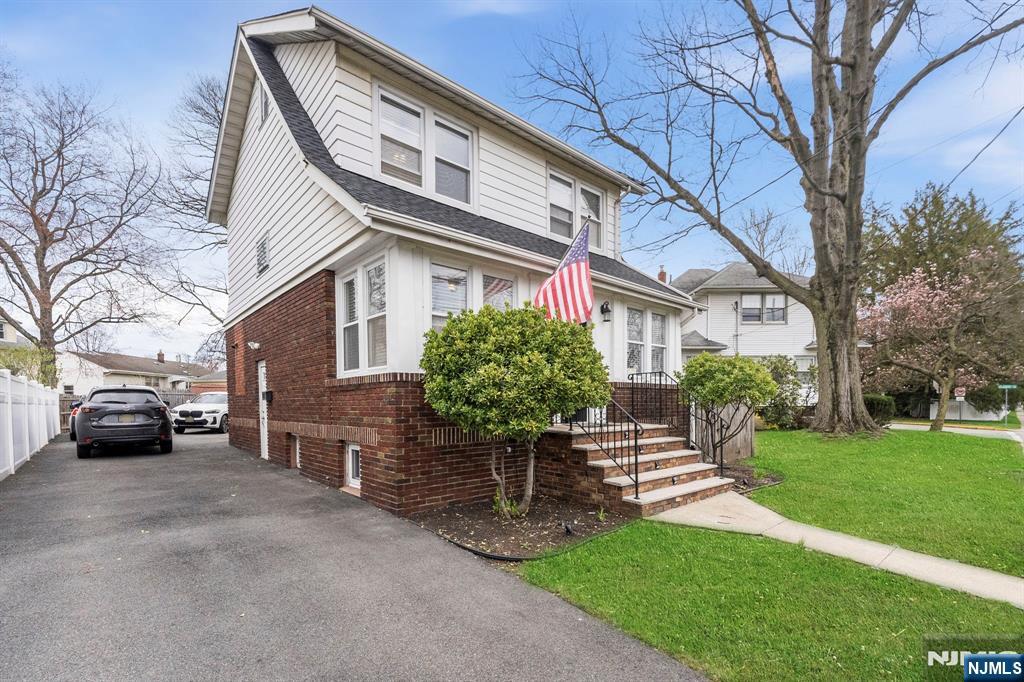 48 Rochelle Avenue Rochelle Park, NJ 07662 - Photo 27 of 30 a front view of a house with garden