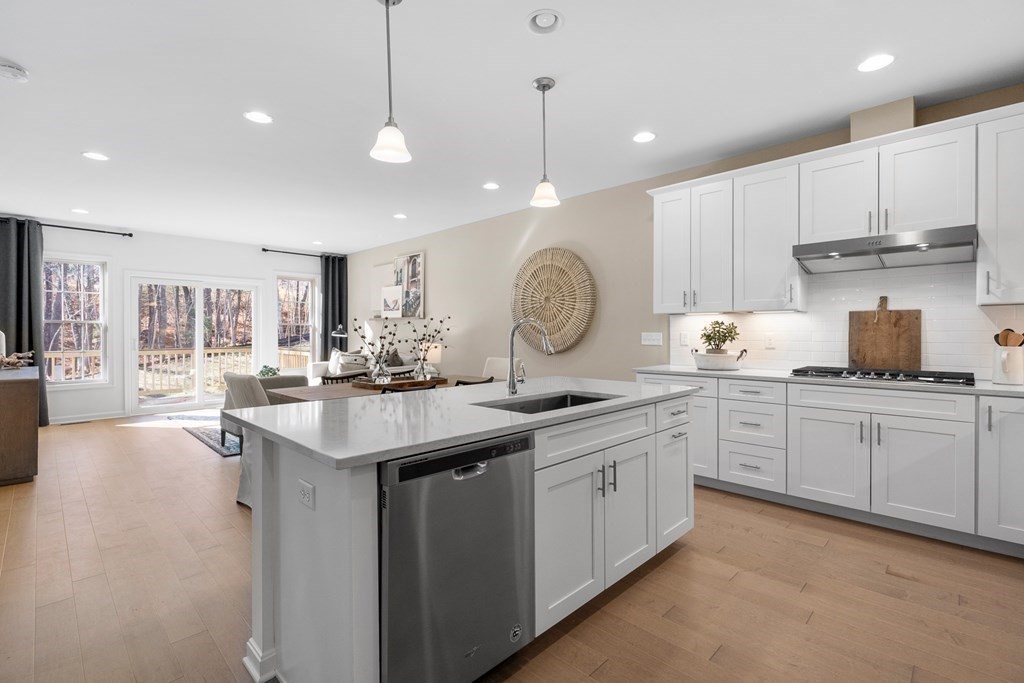 82 Shannon Way, Unit 98 Upton, MA 01568 - Photo 1 of 18 a kitchen with sink stove and cabinets