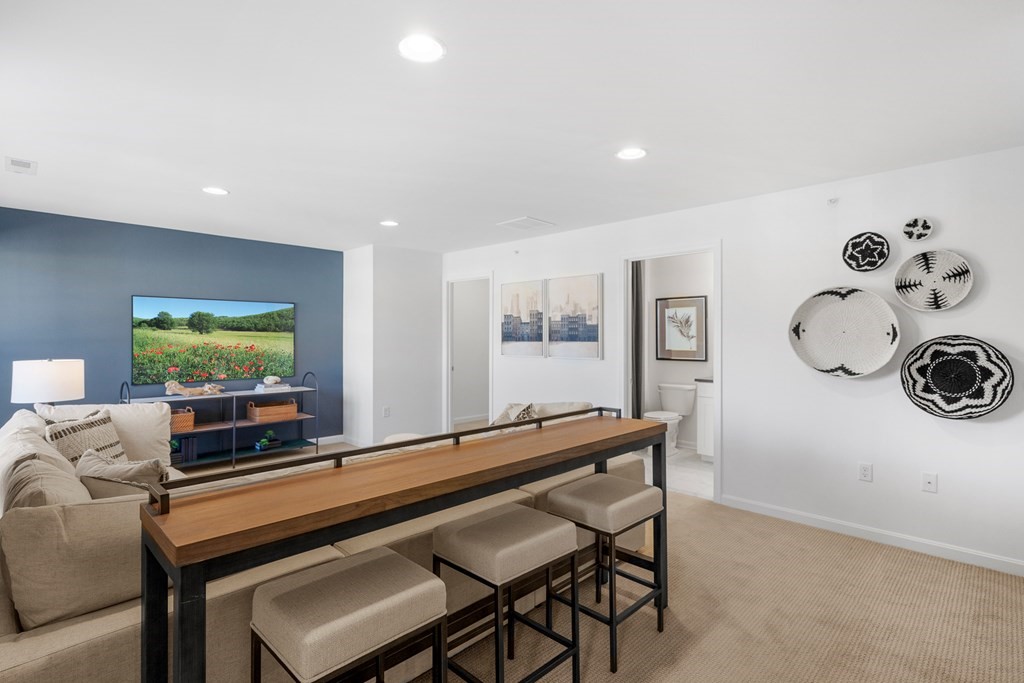82 Shannon Way, Unit 98 Upton, MA 01568 - Photo 15 of 18 a living room with furniture and a flat screen tv