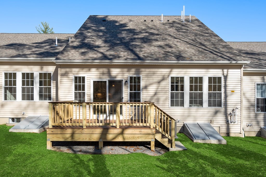 82 Shannon Way, Unit 98 Upton, MA 01568 - Photo 18 of 18 a view of a house with backyard of the house