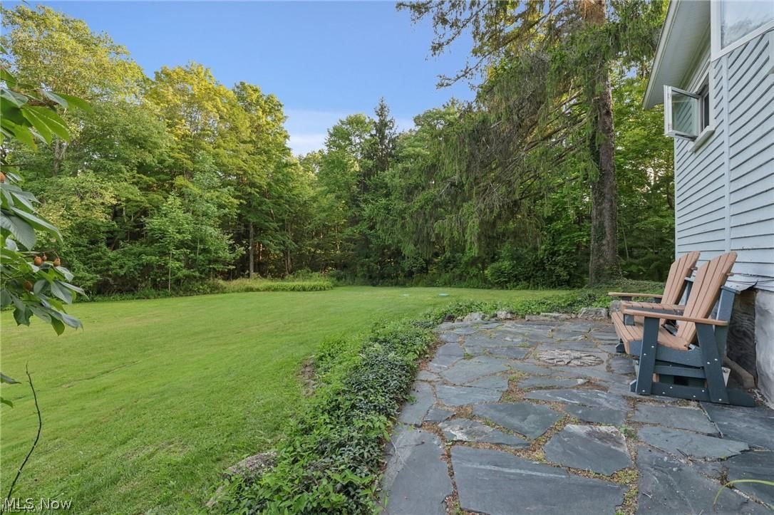 10571 Mayfield Road Chesterland, OH 44026 - Photo 25 of 39 Patio off of back of home faces the woods.