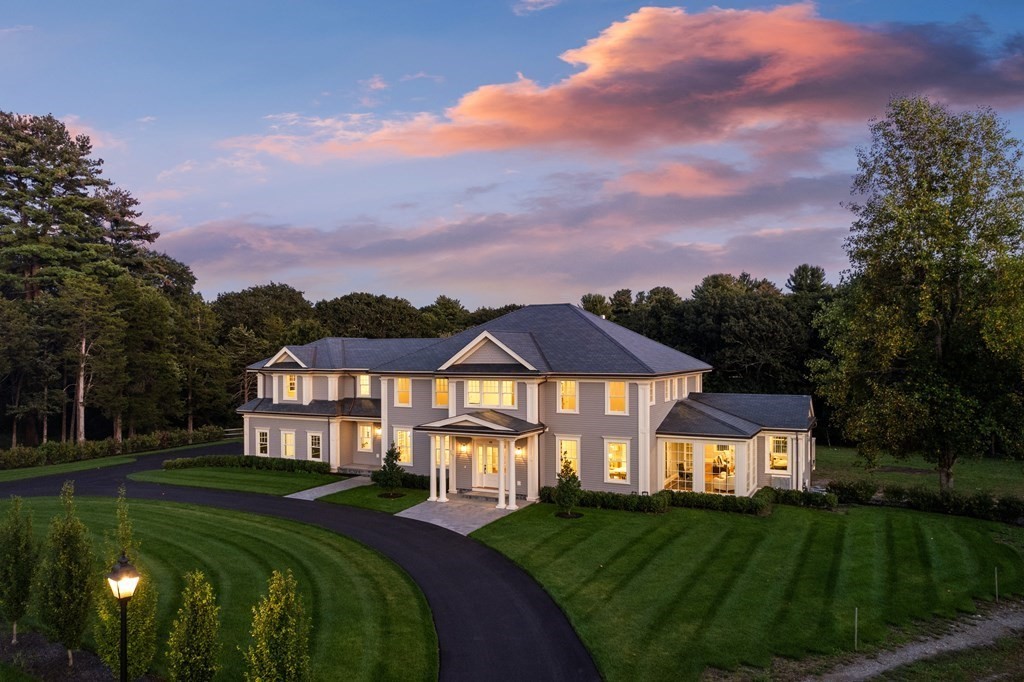 a front view of a house with a yard table and chairs