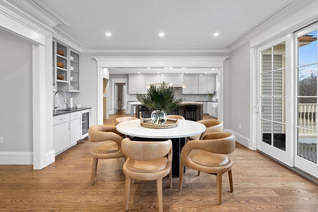 98 Heather Lane Needham, MA 02492 - Photo 21 of 31 a view of a dining room with furniture and a potted plant