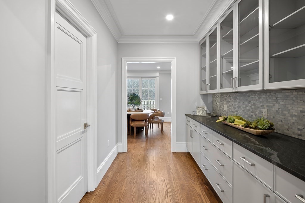 98 Heather Lane Needham, MA 02492 - Photo 23 of 31 a kitchen with granite countertop lots of counter top space and dining table