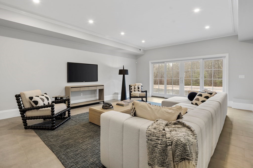 98 Heather Lane Needham, MA 02492 - Photo 30 of 31 a living room with fireplace furniture and a flat screen tv