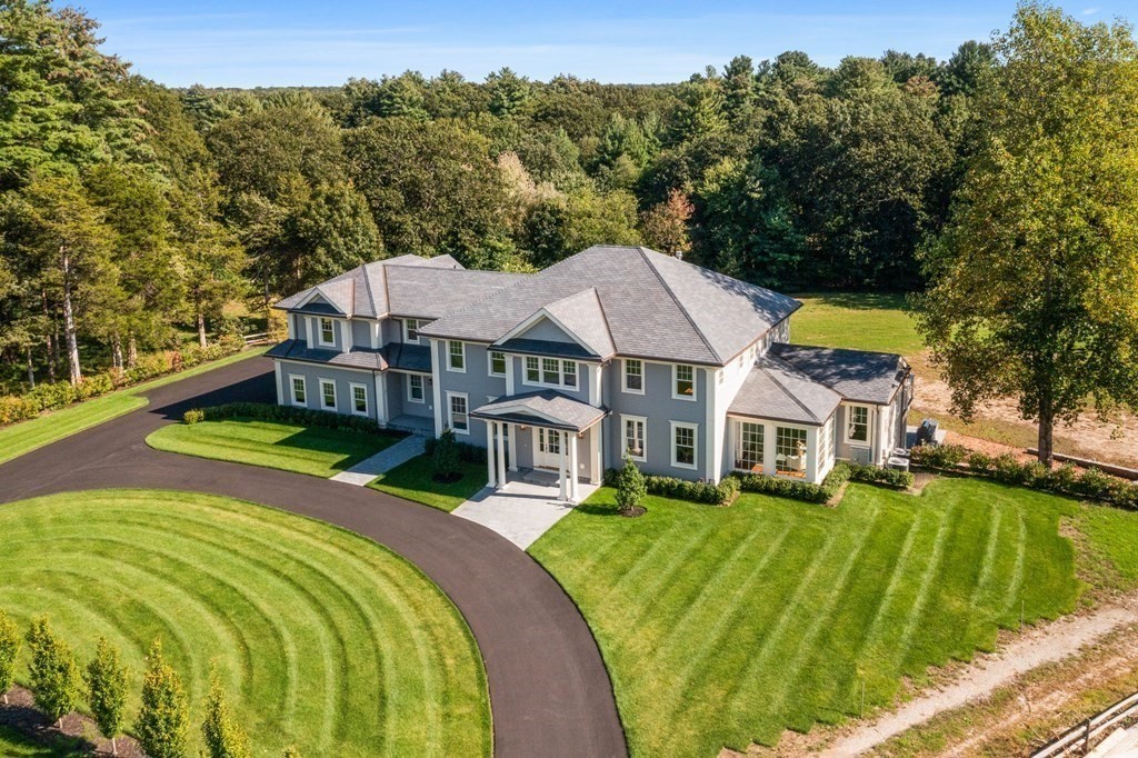 98 Heather Lane Needham, MA 02492 - Photo 5 of 31 a view of a house with a big yard and large trees