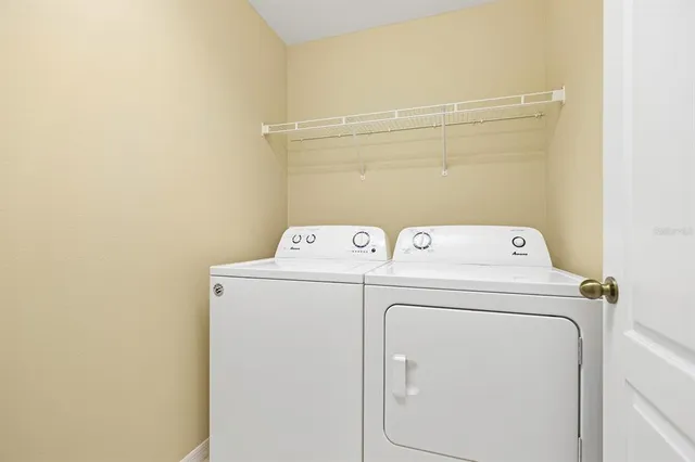 a view of a swimming pool with a yard