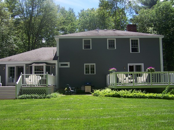 40 Porter Road Boxford, MA 01921 - Photo 15 of 16 a front view of a house with a garden