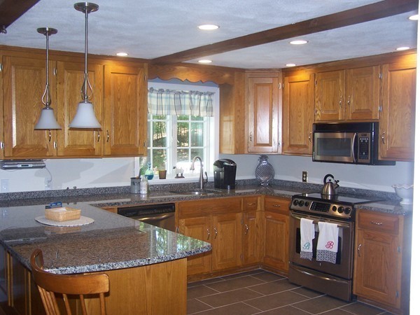 40 Porter Road Boxford, MA 01921 - Photo 3 of 16 a kitchen with sink a window and chairs