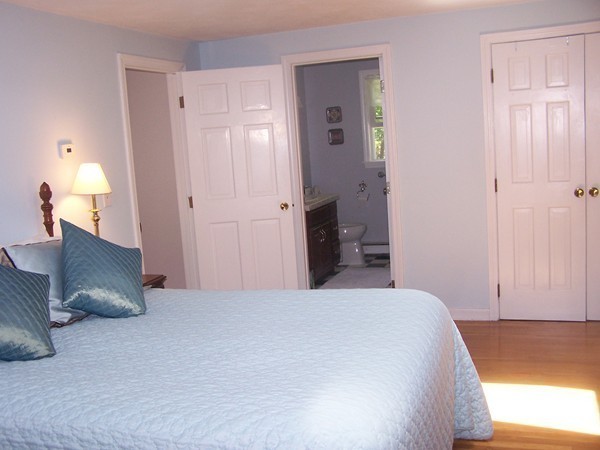 40 Porter Road Boxford, MA 01921 - Photo 7 of 16 a bedroom with a bed and a lamp