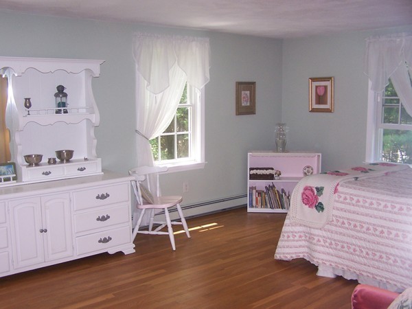 40 Porter Road Boxford, MA 01921 - Photo 9 of 16 a spacious bedroom with a bed and wooden floor