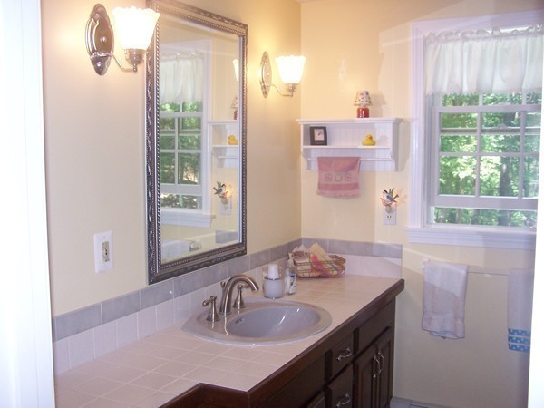 40 Porter Road Boxford, MA 01921 - Photo 10 of 16 a bathroom with a granite countertop sink and a mirror