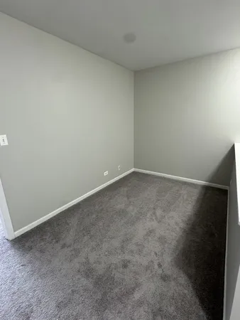 an empty room with a bench